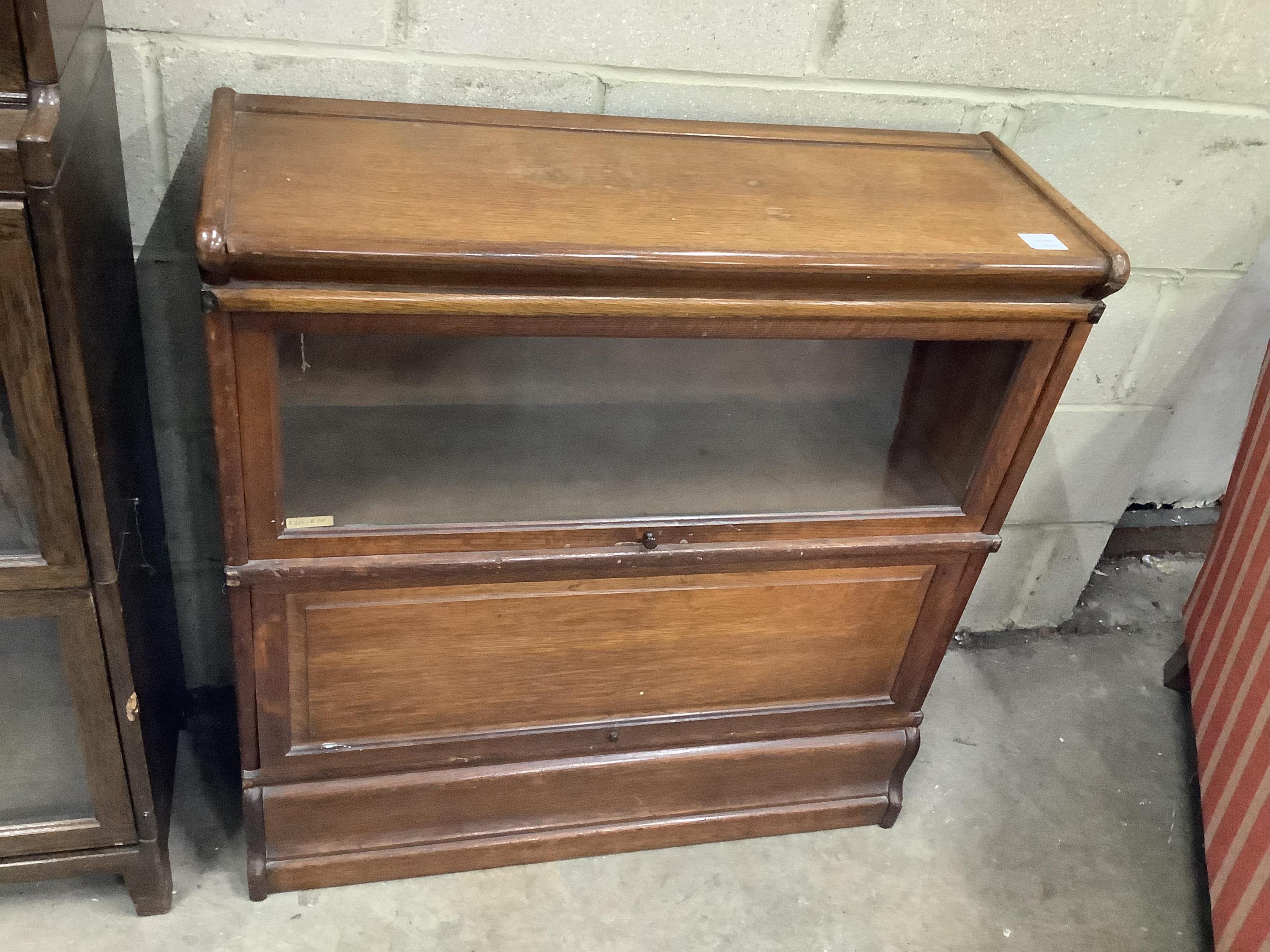 A Globe Wernicke oak two section bookcase, width 86cm, depth 30cm, height 88cm., Provenance - Harrison Zoological Museum, Bowerwood House in Sevenoaks., Condition - fair